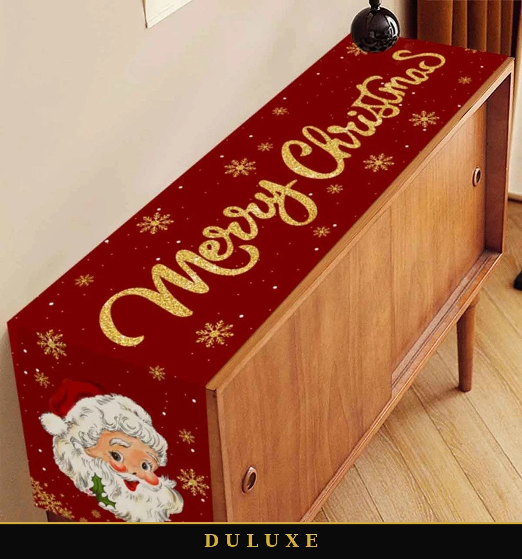 Chemin de table de Noël rouge DULUXE posé sur un buffet en bois, décoration des fêtes